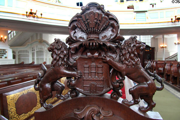 Carved wooden Hamburg coat-of-arms borne by two lions at St Michael's Church. Hamburg, Germany.