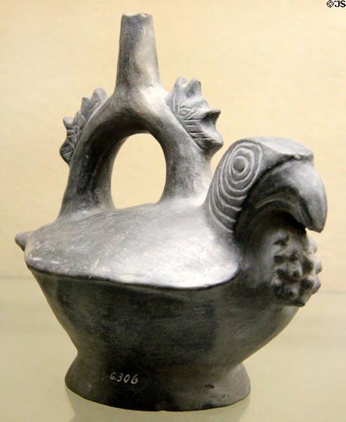 Moche culture ceramic stirrup vessel in shape of parrot with throat pouch (100 BCE- 600 CE) from north coast of Peru at Five Continents Museum. Munich, Germany.