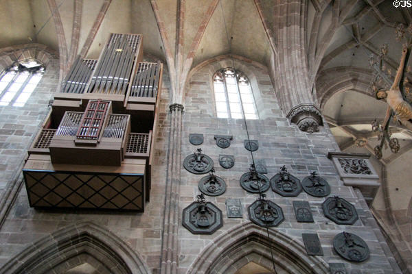 Organ pipes & memorial plaques in St Lawrence Church. Nuremberg, Germany.