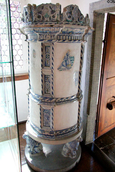 Ceramic heating stove with lion base at Lindau Municipal Museum. Lindau im Bodensee, Germany.