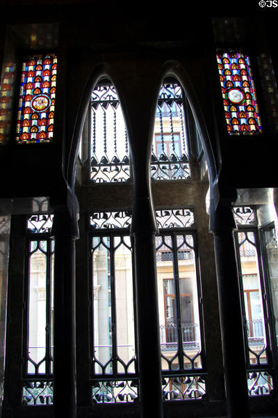 Parabolic arches of windows in rear hall at Palau Güell. Barcelona, Spain.
