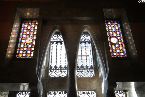 Parabolic arches of windows in rear hall at Palau Güell. Barcelona, Spain.