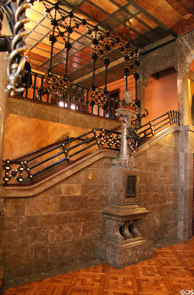 Stairway running up side of central hall at Palau Güell. Barcelona, Spain.