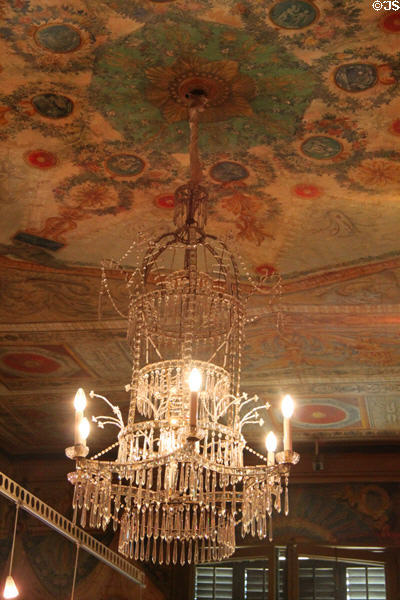 Chandelier on painted ceiling at Palau Reial. Barcelona, Spain.