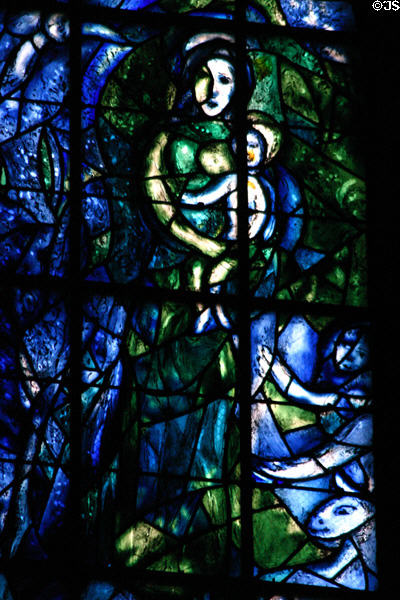 Stained glass Virgin Mary carrying baby Jesus by Marc Chagall in Cathedral. Reims, France.