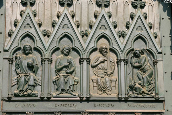 Bronze panel of central door of Cathedral showing Christ, Peter (with keys), Paul (with sword) & archangel Michael. Strasbourg, France.
