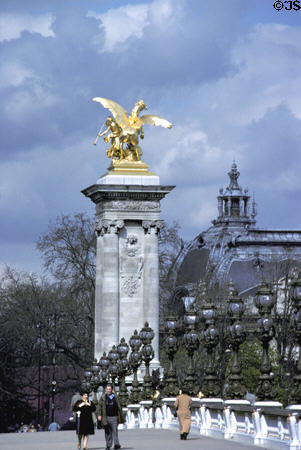 Pillars & lamps of Alexandre III bridge plus Petit Palais (1900) exposition hall. Paris, France.