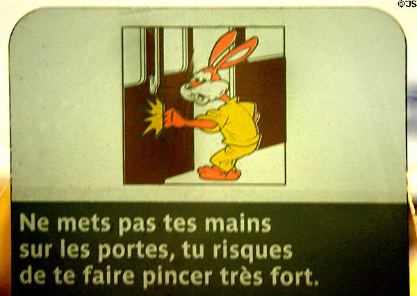 RATP metro train rabbit warning sign not to put fingers between closing doors. Paris, France.