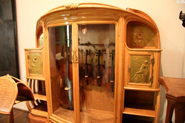 Art Nouveau armoire for string quartet instruments (c1901) by Alexandre Louis-Marie Charpentier of Paris at Museum of Decorative Arts. Paris, France.