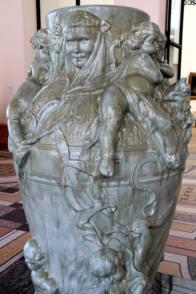 Detail of ceramic vase with mascarons & putti (c1895) by Isidore de Rudder at Petit Palace Museum. Paris, France.