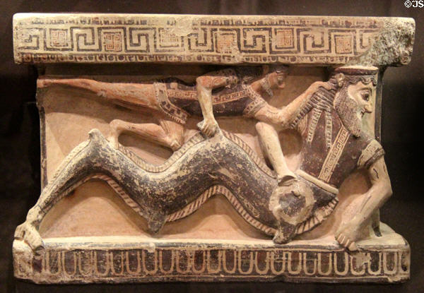 Greek terracotta altar Arula (4thC BCE) from Gela, Sicily shows combat between Heracles & Triton at Louvre Museum. Paris, France.