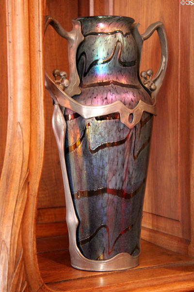 Iridescent Art Nouveau ceramic vase at Maxim's Art Nouveau Collection 1900. Paris, France.