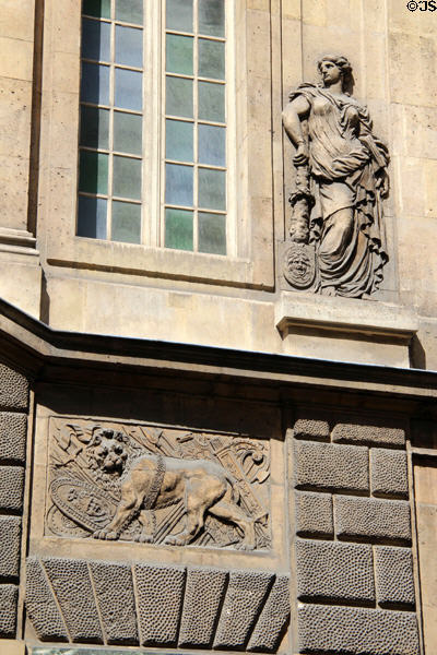 Carvings of lion & female figure on main facade of Carnavalet Museum. Paris, France.