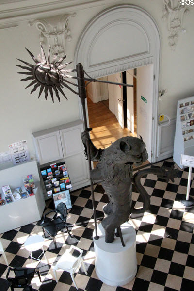 Town Hall belfry wind vane held by sculpted Lion of Arras (1554) in entrance hall at Arras Fine Art Museum. Arras, France.