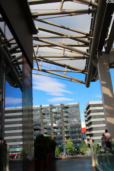 Confluence shopping center & buildings across basin of Saône River. Lyon, France.