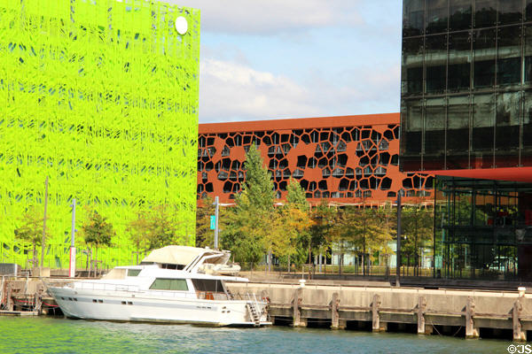 Green Euronews building (2015) & red Mob Hotel (2017) in Confluence district. Lyon, France.