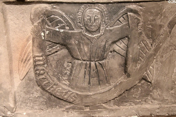 Detail of medieval tomb plaque carved with winged angel symbol of Evangelist St Matthew at Rock of Cashel. Cashel, Ireland.