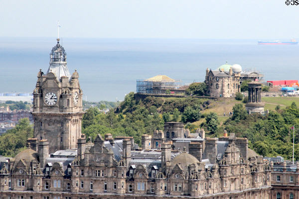 Balmoral Hotel (formerly North British Hotel, NB) (1902) with monuments on Calton Hill beyond. Edinburgh, Scotland.