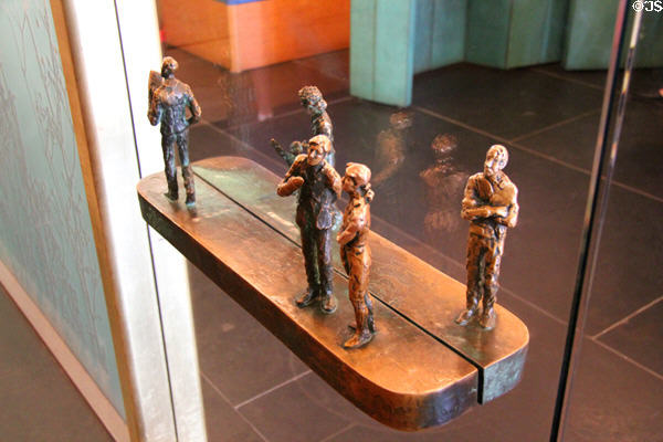 Sculpted figures on door handles at Queens Gallery. Edinburgh, Scotland.