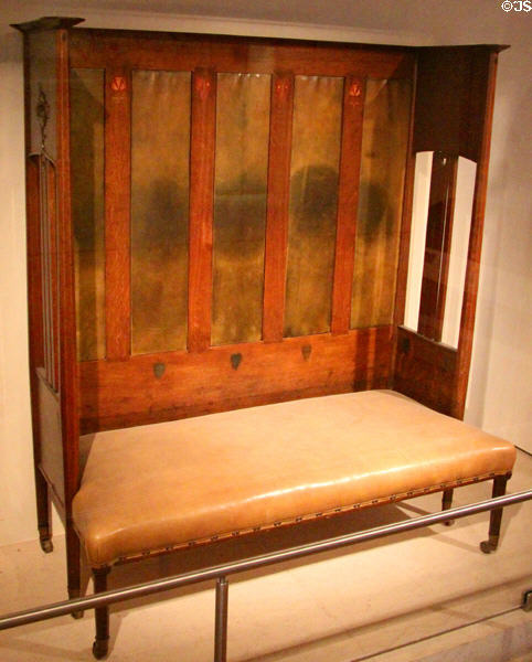 Oak settle (1901) by Wylie & Lochhead displayed during Glasgow International Exhibition at National Museum of Scotland. Edinburgh, Scotland.