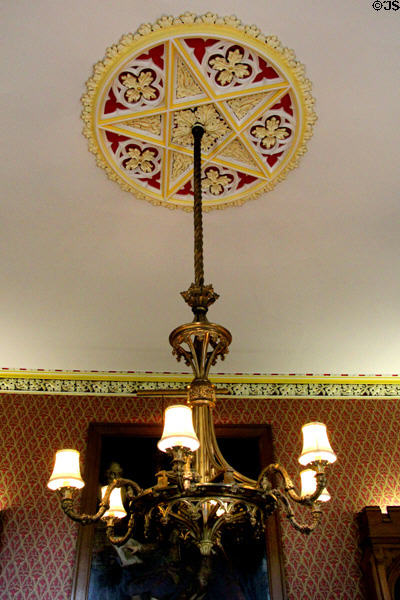Chandelier under ceiling molding in library at Scone Palace. Perth, Scotland.
