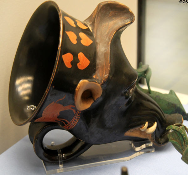 Side view of Boar-head ceramic rhyton (c460 BCE) attrib. to Sotades made in Athens at British Museum. London, United Kingdom.