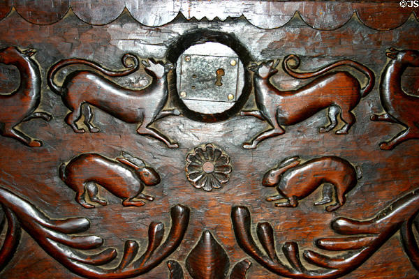 Carved oak chest front with rabbits & dogs at La Purisima Mission. Lompoc, CA.