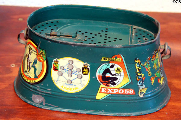 Metal frog carrier decorated with Belgian decals at Angels Camp Museum. Angels Camp, CA.