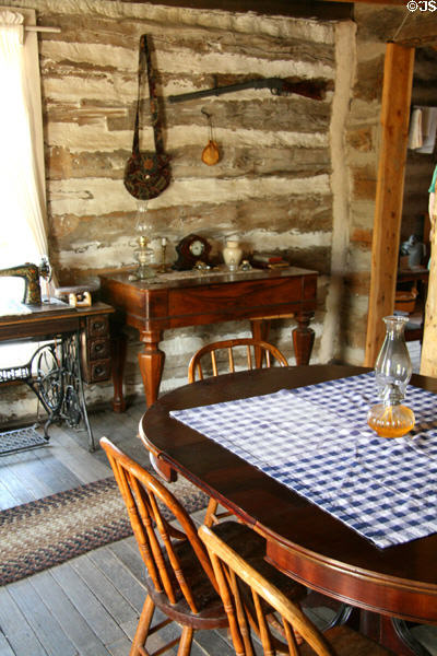 Parlor of settler's log cabin at Clear Creek History Park. Golden, CO.