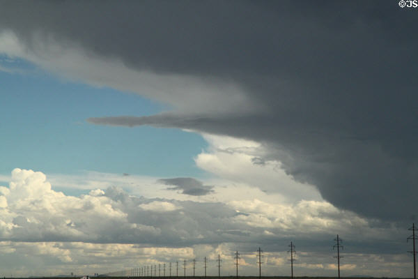 Storm clouds over Colorado power poles. CO.