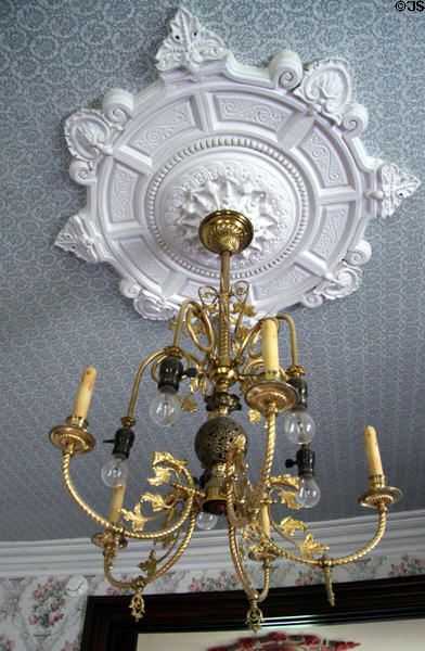 Ceiling medallion with combination gas & electric chandelier at Frank Bloom Mansion. Trinidad, CO.