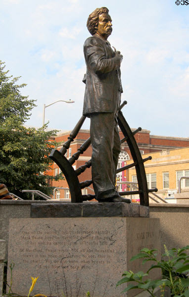 Statue of Mark Twain with Riverboat wheel at Hartford Public Library. Hartford, CT.