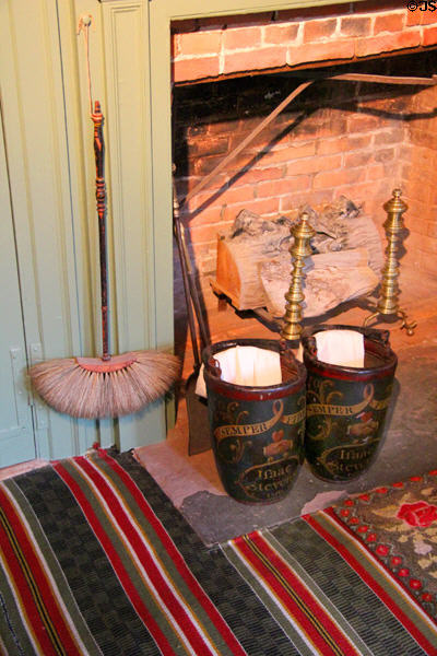 Fireplace with leather fire buckets at Isaac Stevens House. Wethersfield, CT.