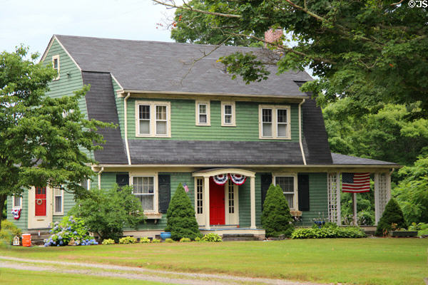 Green house with hip roof. Haddam, CT.
