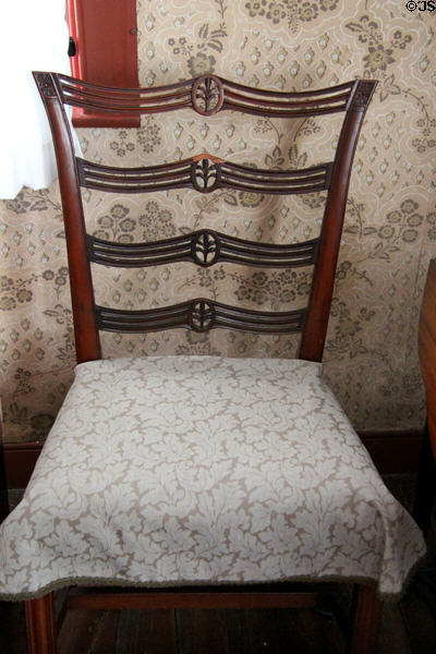 Early American chair with carved trees in ladder back at Denison Homestead Museum. Stonington, CT.