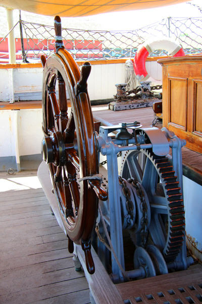 Ships wheel of three-masted tall ship Joseph Conrad at Mystic Seaport. Mystic, CT.