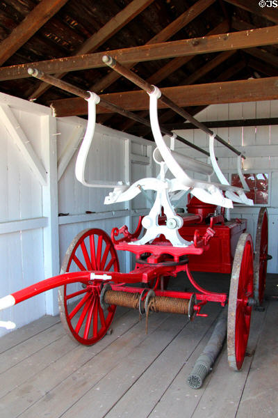 Horse-drawn fire pumper at Mystic Seaport. Mystic, CT.