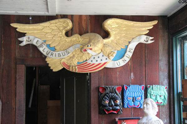 Eagle with shield shipboard in Shipcarver's Shop at Mystic Seaport. Mystic, CT.