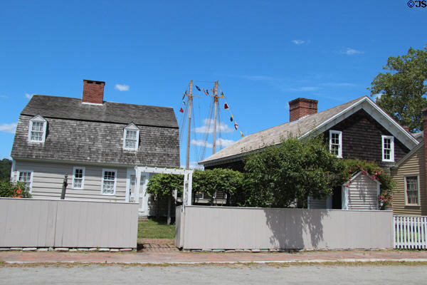 Streetscape with ship masts at Mystic Seaport. Mystic, CT.