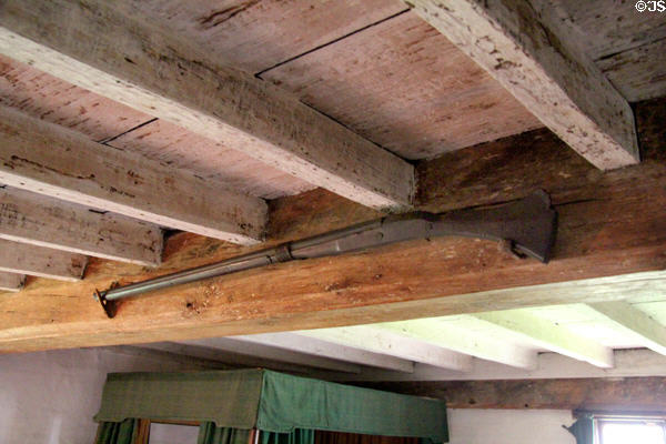 Early American firearm hanging from beam at Joshua Hempstead House. New London, CT.