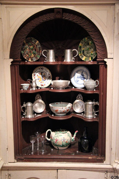 Cabinet with collection of pewter & ceramic vessels at Yale University Art Gallery. New Haven, CT.