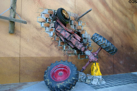 Twister© attraction with car embedded in wall at Universal Studios. Orlando, FL.