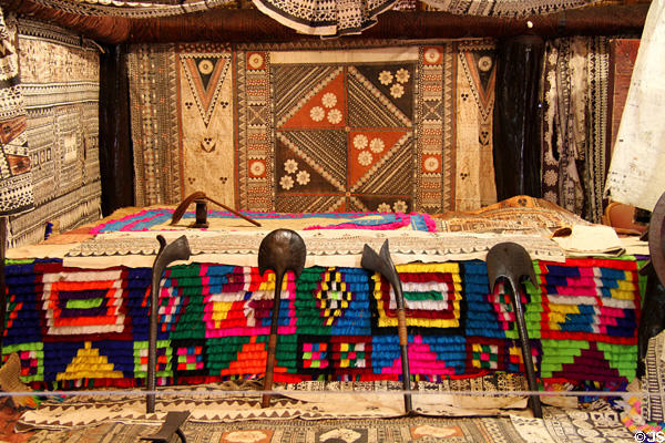 Collection of clubs & tapa bark cloths in Chief's Dwelling in Fijian village at Polynesian Cultural Center. Laie, HI.