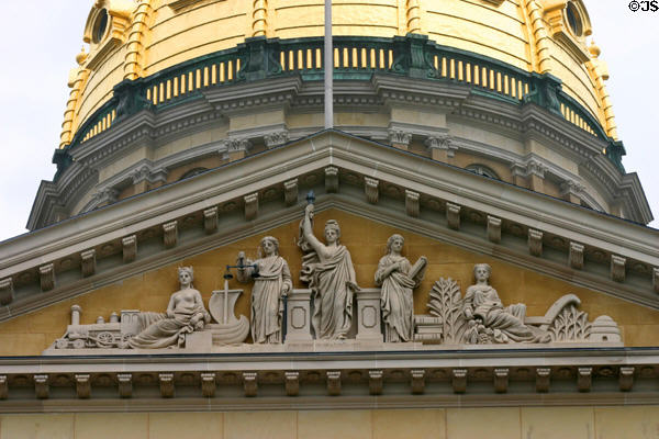 Sculpted pediment of Iowa State Capitol with allegorical figures including locomotive. Des Moines, IA.