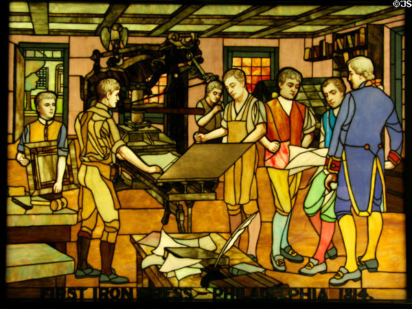 Details of stained glass window (1914) of Printers History showing First Iron Press in Philadelphia in 1814 at Stained Glass Museum. Chicago, IL.