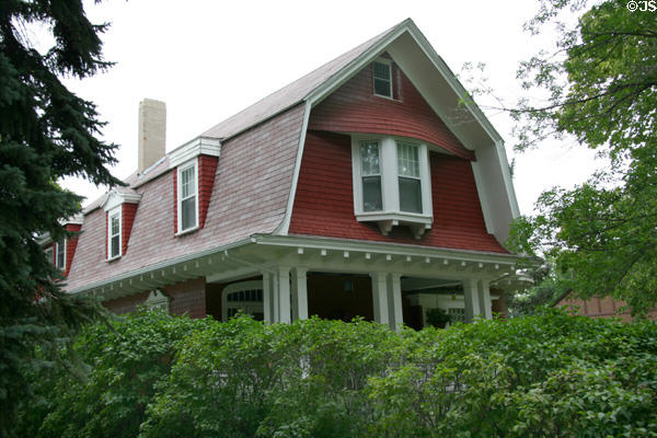 Double hipped gambrel-roof of house at 123 Clark Ave. in Moss Mansion heritage district. Billings, MT. Style: Colonial Revival.