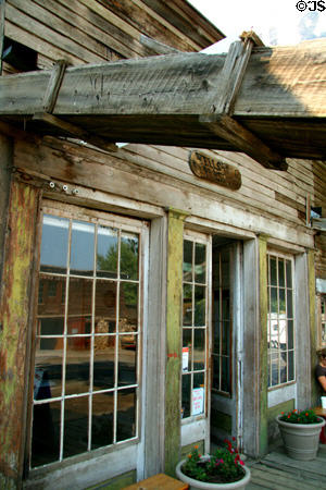 Wells Fargo Express Office with wooden drain pipe crossing sidewalk. Virginia City, MT.
