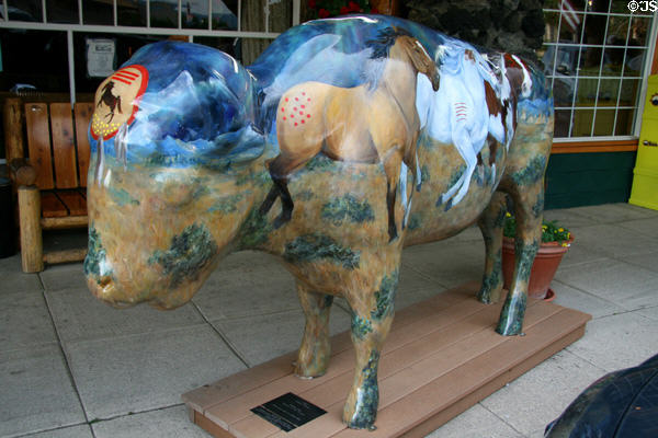 Painted buffalo called Ponies of the People of Indian Ponies under Northern Lights by Mitzi Nelson at Yellowstone Historic Center. West Yellowstone, MT.