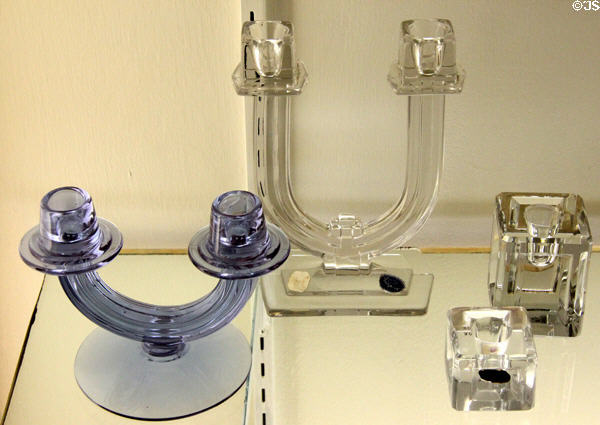 Duo candlestick (c1931-9) by George Sakier for Fostoria Glass Co., Moundsville, WV; U candlestick (1934-57) by A.H. Heisey of Newark, OH & candlesticks #492 by Pristine Table Architecture of Cambridge, Oh at Museum of American Glass. Milville, NJ.