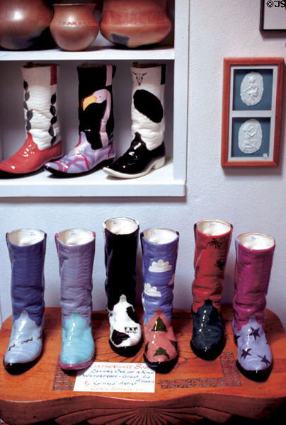 Ceramic cowboy boots in shop in Chimayo. NM.